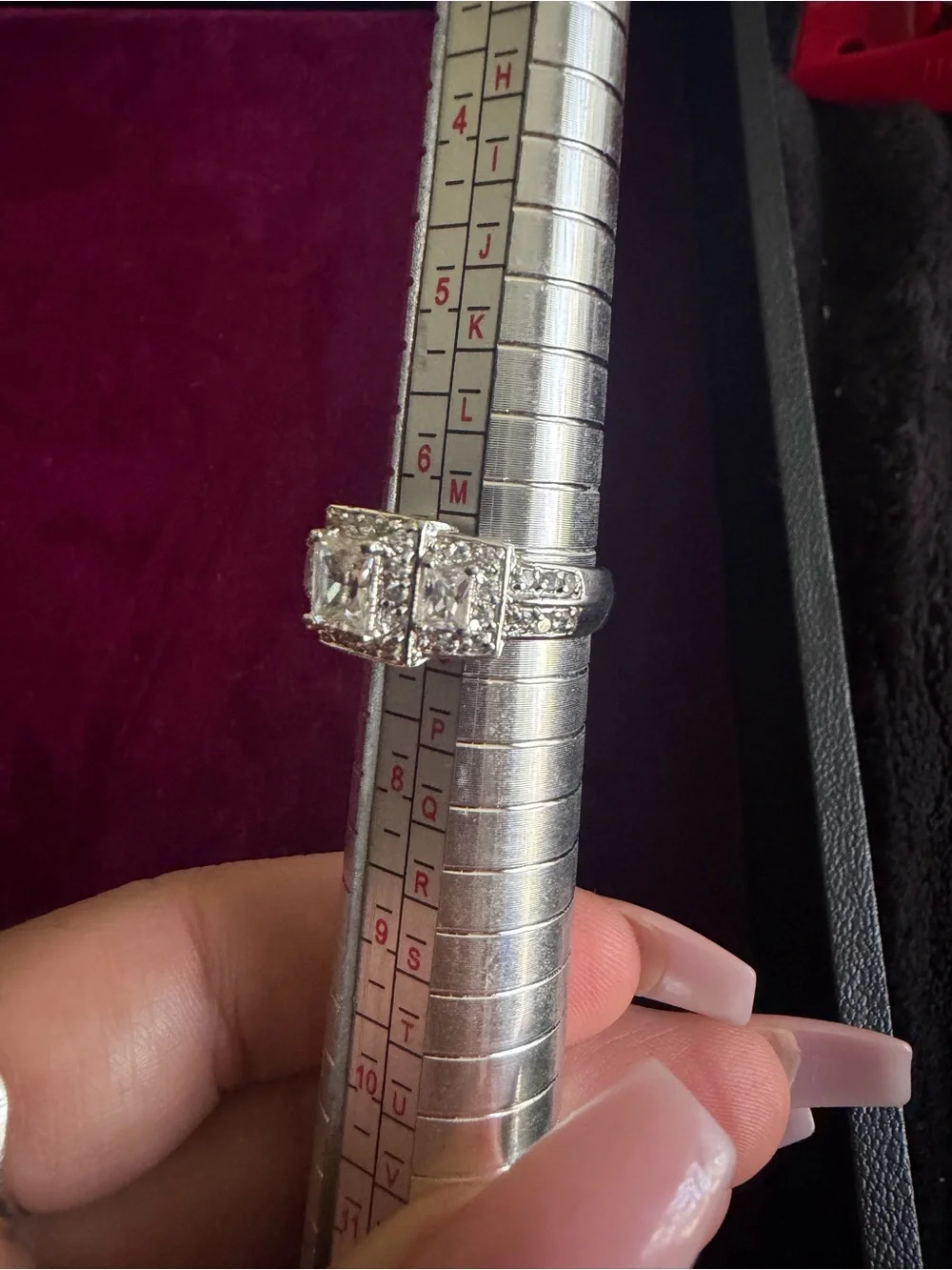Clear 3 square stones with clusters ring and side stones. Size 7